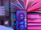 a stack of books and a smartphone