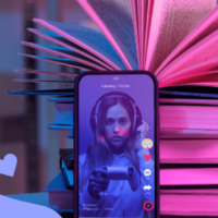 a stack of books and a smartphone