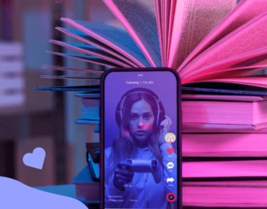 a stack of books and a smartphone